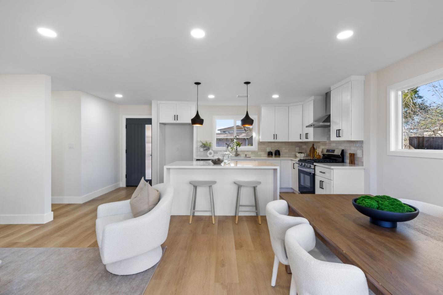 390 Valmy Street Milpitas, CA 95035 - Photo 11 of 37 a kitchen with white cabinets and stainless steel appliances