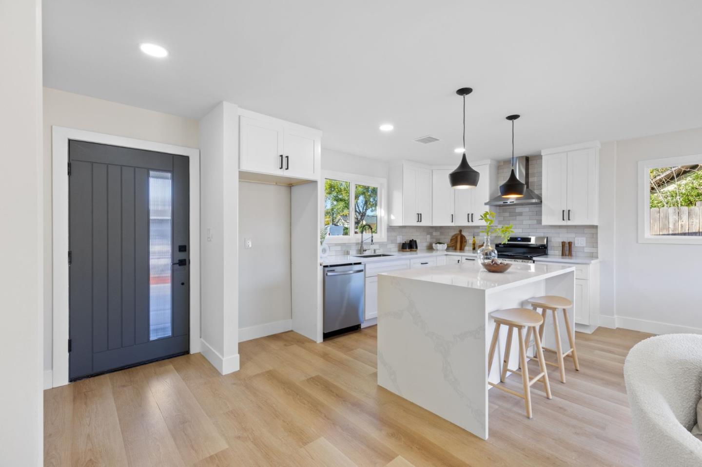 390 Valmy Street Milpitas, CA 95035 - Photo 13 of 37 a kitchen with white cabinets and stainless steel appliances