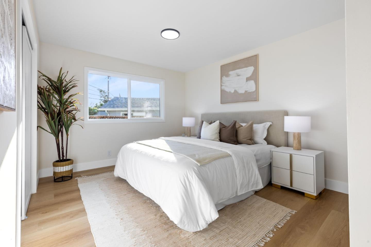 390 Valmy Street Milpitas, CA 95035 - Photo 17 of 37 a bedroom with bed and a large window