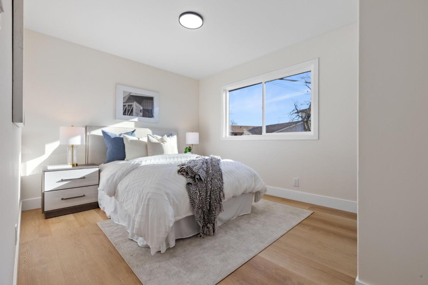 390 Valmy Street Milpitas, CA 95035 - Photo 20 of 37 a bed room with a bed and a night stand