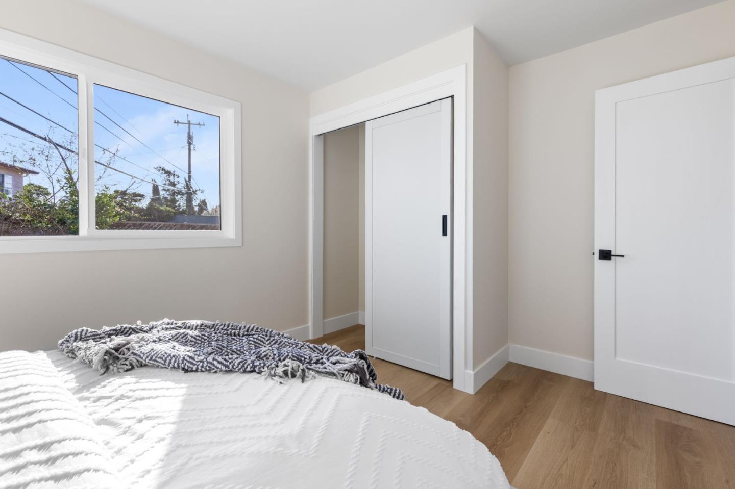 390 Valmy Street Milpitas, CA 95035 - Photo 21 of 37 a bedroom with a bed and a painting on the wall