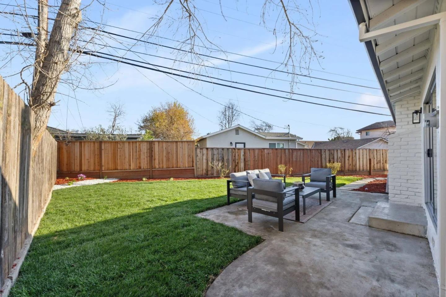 390 Valmy Street Milpitas, CA 95035 - Photo 24 of 37 a backyard of a house with table and chairs