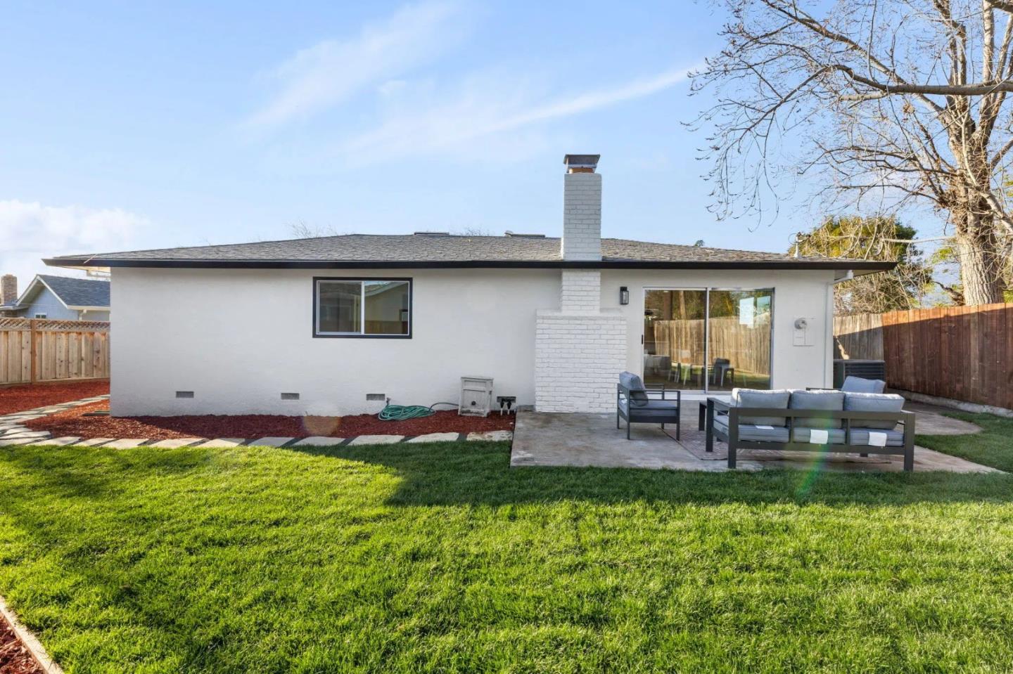 390 Valmy Street Milpitas, CA 95035 - Photo 26 of 37 a backyard of a house with table and chairs