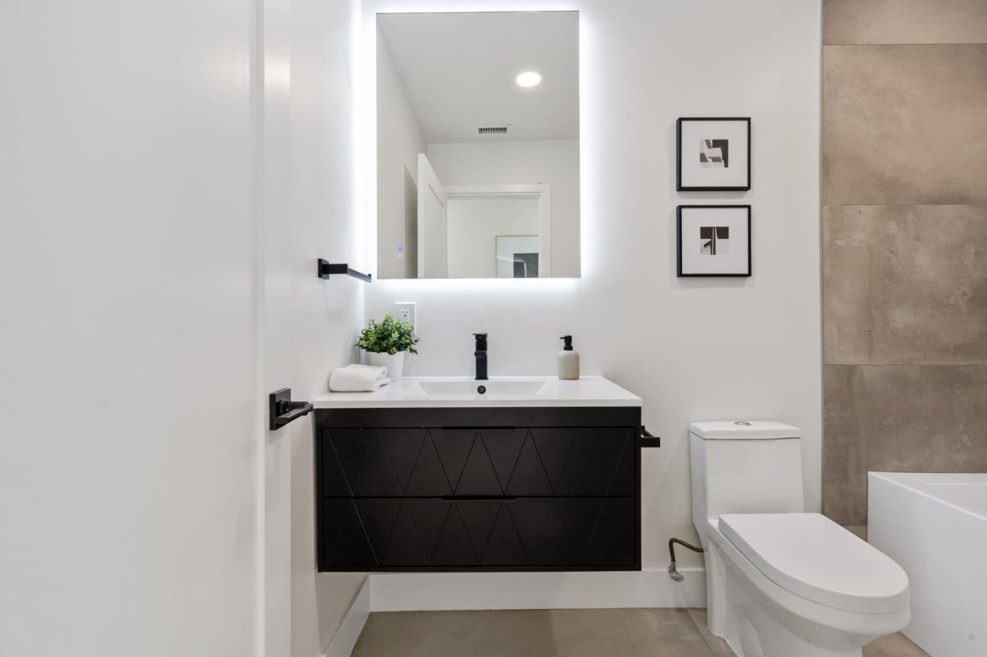 390 Valmy Street Milpitas, CA 95035 - Photo 29 of 37 a bathroom with a sink a toilet and mirror