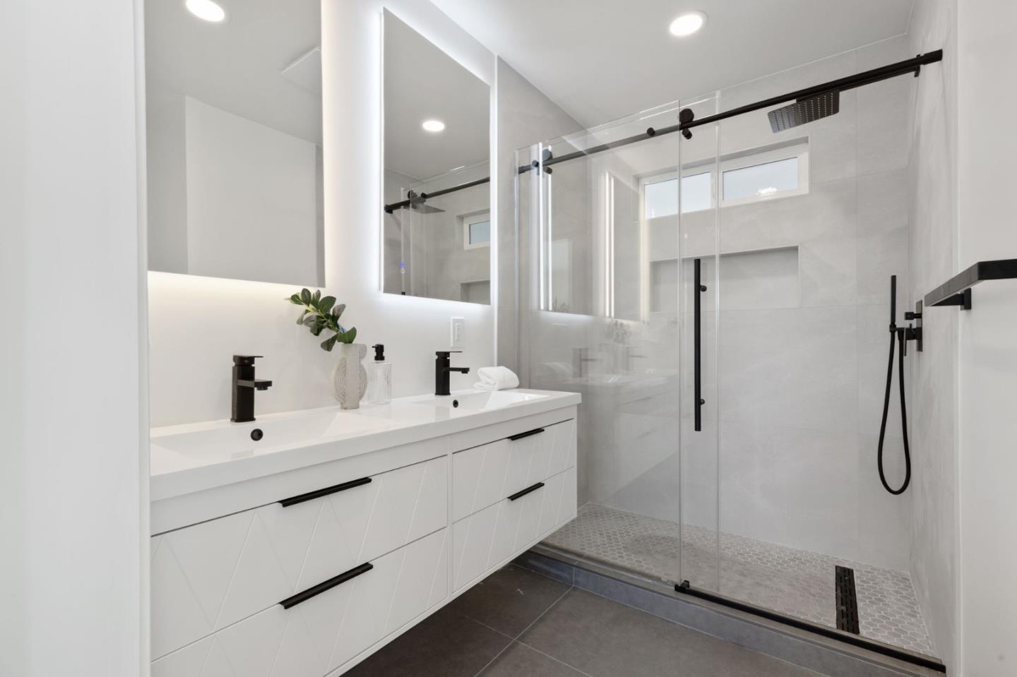 390 Valmy Street Milpitas, CA 95035 - Photo 32 of 37 a bathroom with a double vanity sink mirror and shower