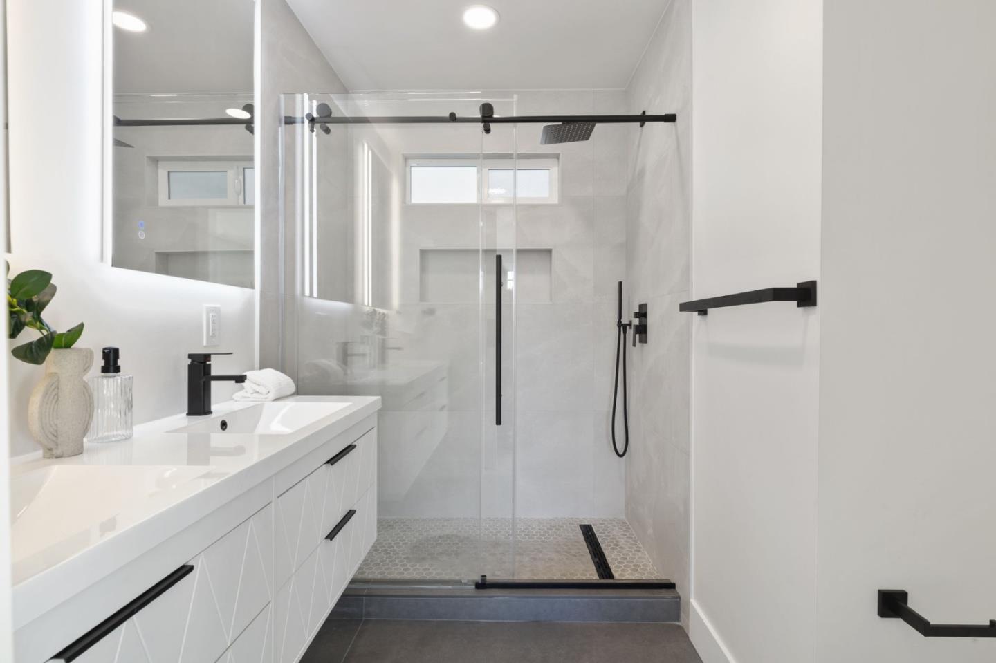 390 Valmy Street Milpitas, CA 95035 - Photo 33 of 37 a bathroom with a sink and shower