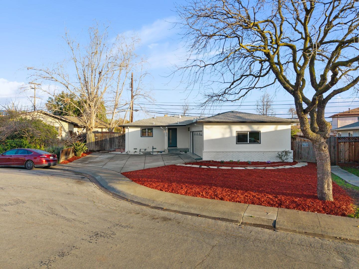 390 Valmy Street Milpitas, CA 95035 - Photo 36 of 37 a view of a house with a yard and garage