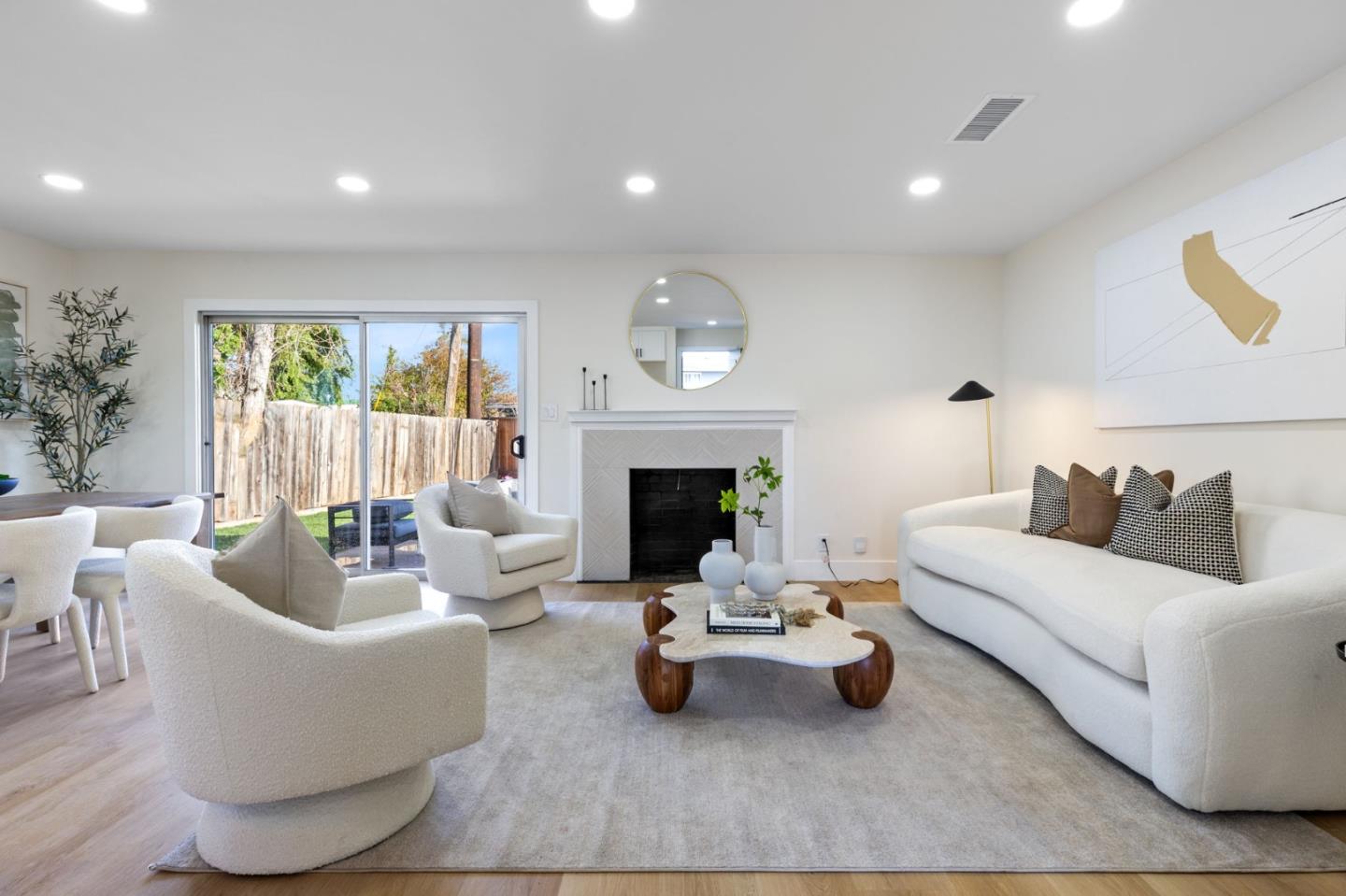 390 Valmy Street Milpitas, CA 95035 - Photo 4 of 37 a living room with furniture and a fireplace