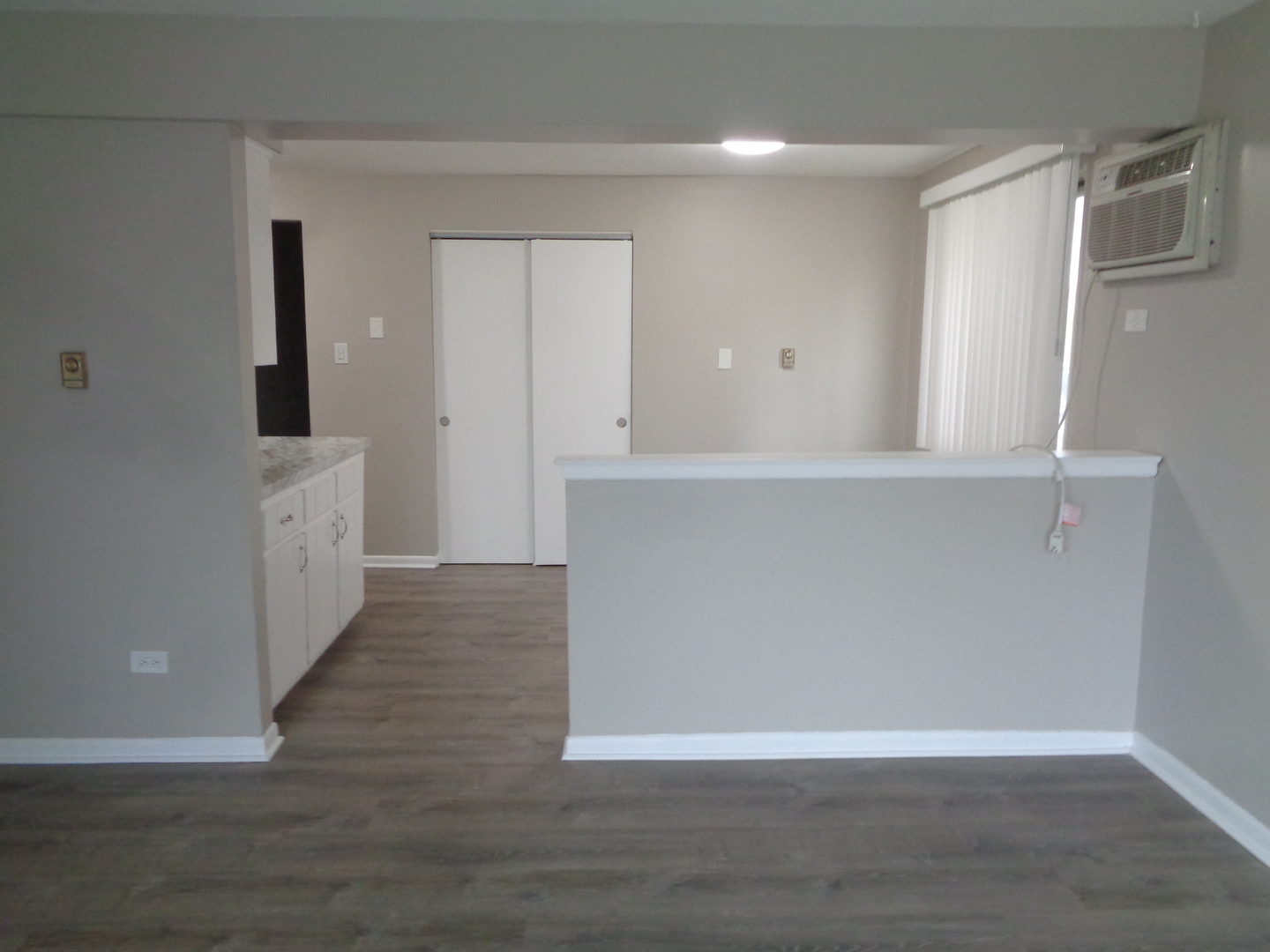 6045 Marshall Avenue, Unit 1W Chicago Ridge, IL 60415 - Photo 3 of 10 a view of a kitchen with wooden floor