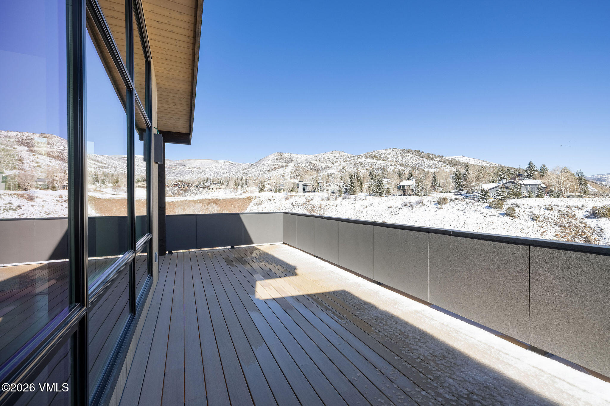 351 Longhorn Road, Unit A Edwards, CO 81632 - Photo 5 of 34 a view of a balcony with wooden floor and fence