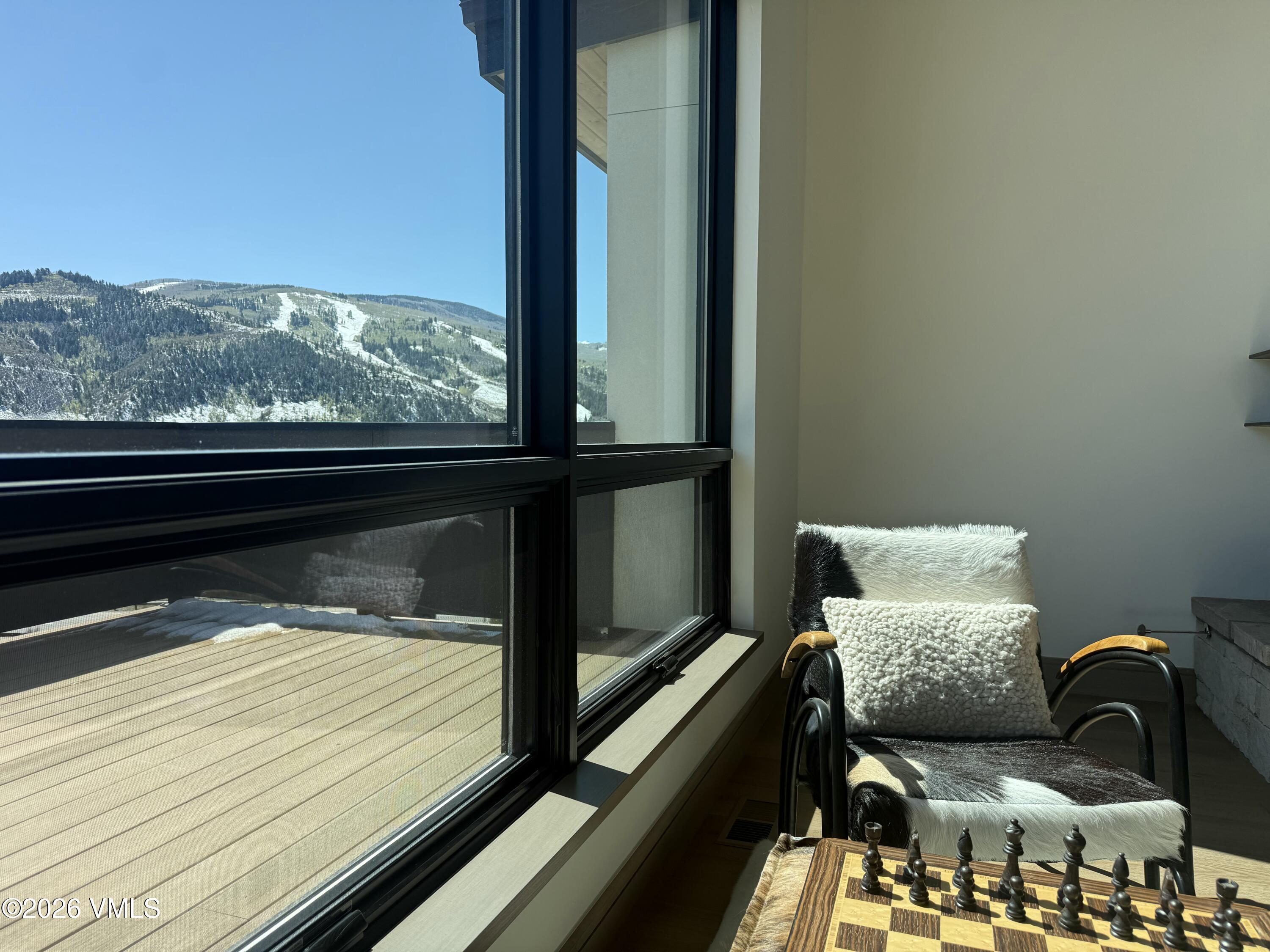 351 Longhorn Road, Unit A Edwards, CO 81632 - Photo 9 of 34 a couple of blue chairs sitting in front of a window