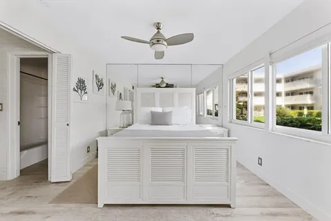 a view of kitchen with cabinets and window