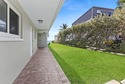 a view of a pathway both side of house