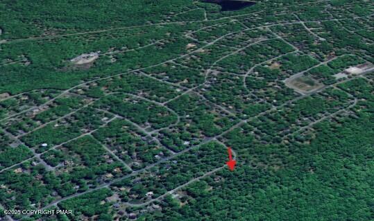 Lot 44 Amos Circle Bushkill, PA 18324 - Photo 3 of 4 a backyard of a house with lots of green space and plants