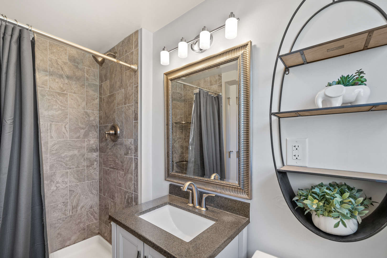 272 Scott Street Wheeling, IL 60090 - Photo 11 of 12 a bathroom with a sink and a mirror