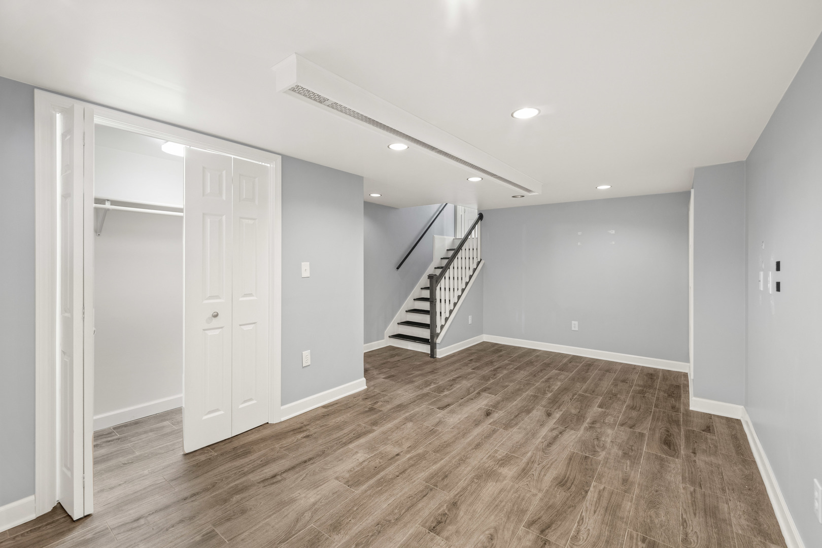 272 Scott Street Wheeling, IL 60090 - Photo 10 of 12 a view of an empty room with wooden floor and stairs