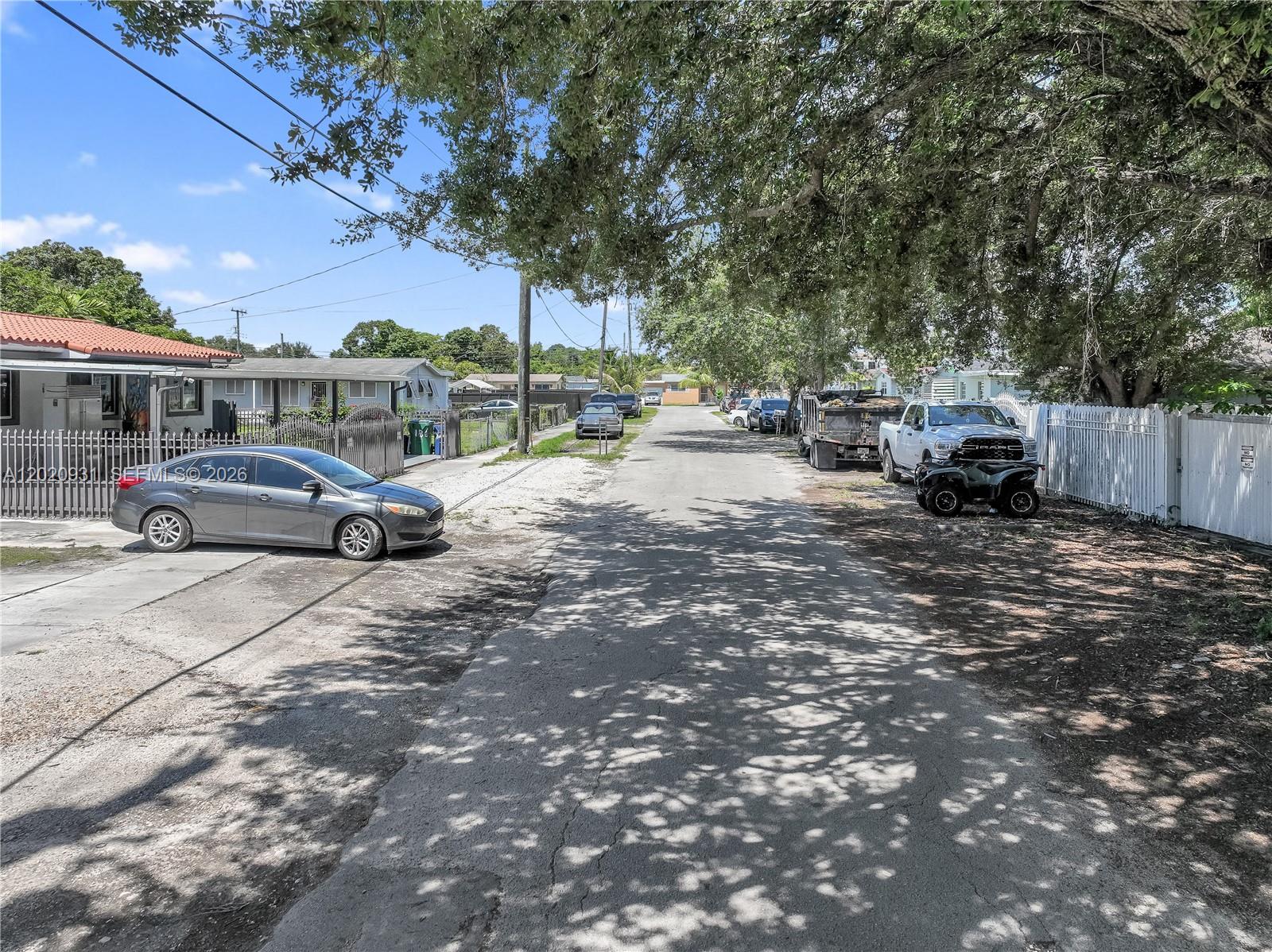 1360 Northwest 77th Street Miami, FL 33147 - Photo 32 of 41 a car parked on the side of the road
