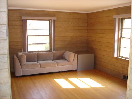 937 Illinois Road Wilmette, IL 60091 - Photo 7 of 13 a living room with a couch and a window