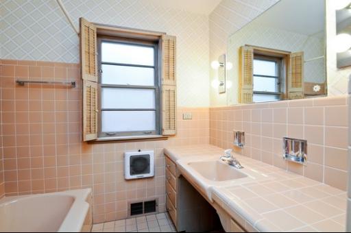 937 Illinois Road Wilmette, IL 60091 - Photo 9 of 13 a bathroom with a sink and a bathtub