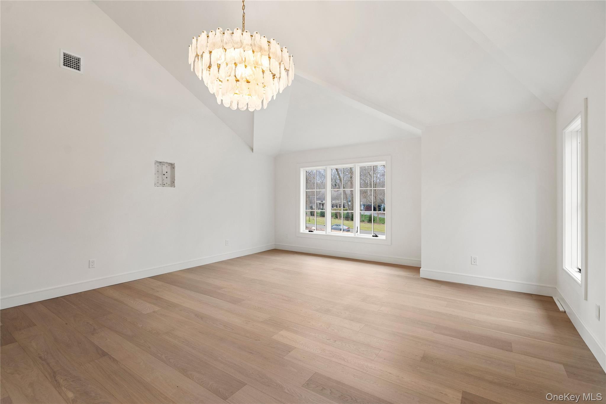 9 Wilderness Road St. James, NY 11780 - Photo 18 of 44 Upstairs Primary BR with Wide Plank White Oak Flooring, Vaulted Ceilings, 2 Walk In Closets, Spa Inspired Primary Bathroom