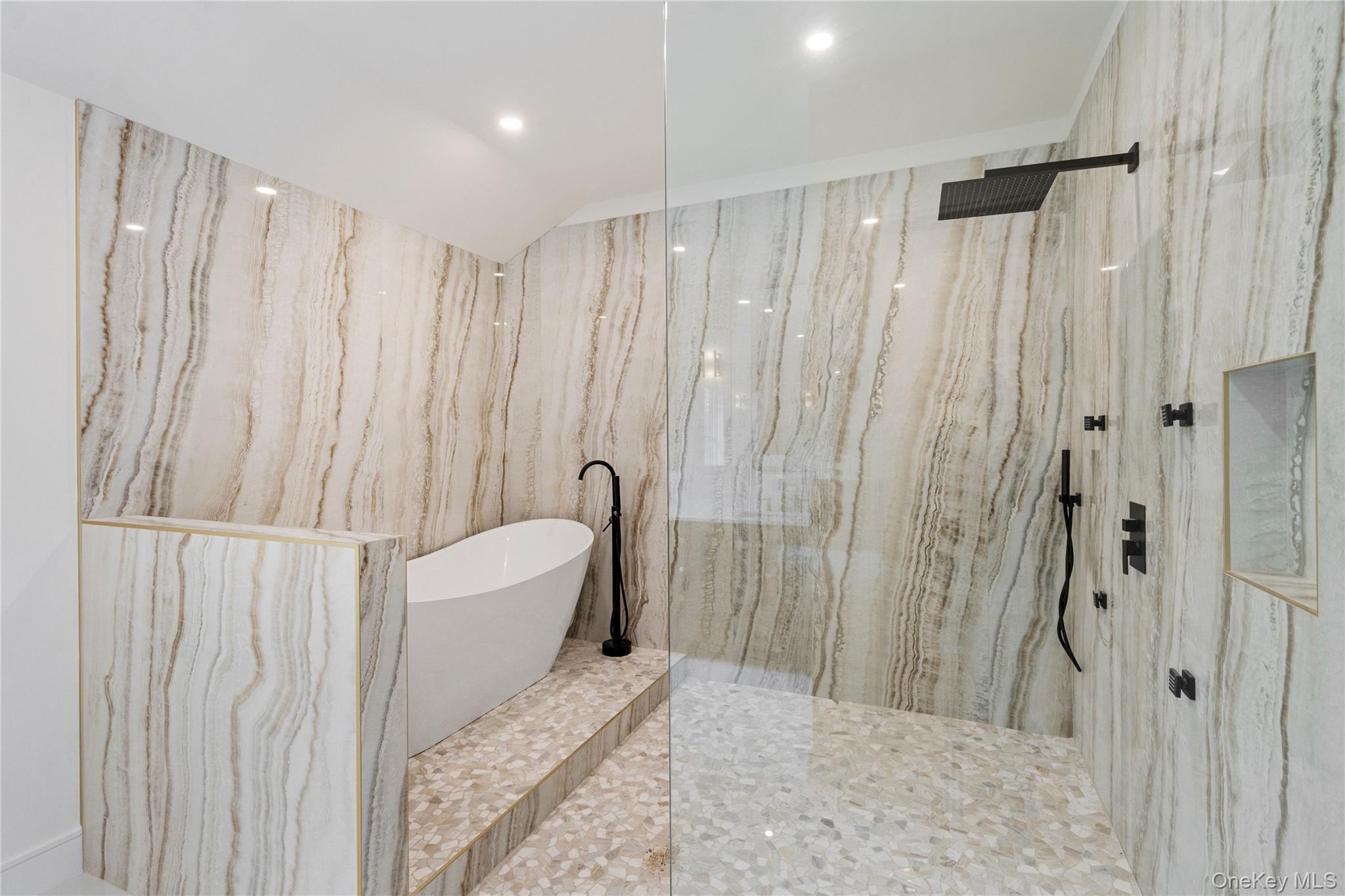 9 Wilderness Road St. James, NY 11780 - Photo 20 of 44 Spa Inspired Primary Bathroom with Floor to Ceiling Tile, Soaker Tub, Rain Head Shower, Custom Niches, Dual Vanity