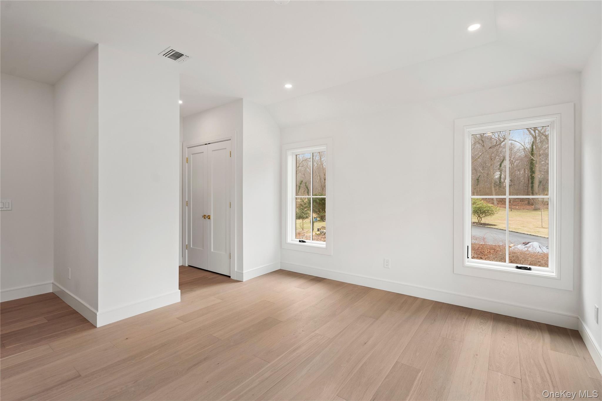 9 Wilderness Road St. James, NY 11780 - Photo 30 of 44 Junior En-Suite with Wide Plank White Oak Flooring, Walk In Closet, Full Bathroom with Walk In Shower, Rounded Archway