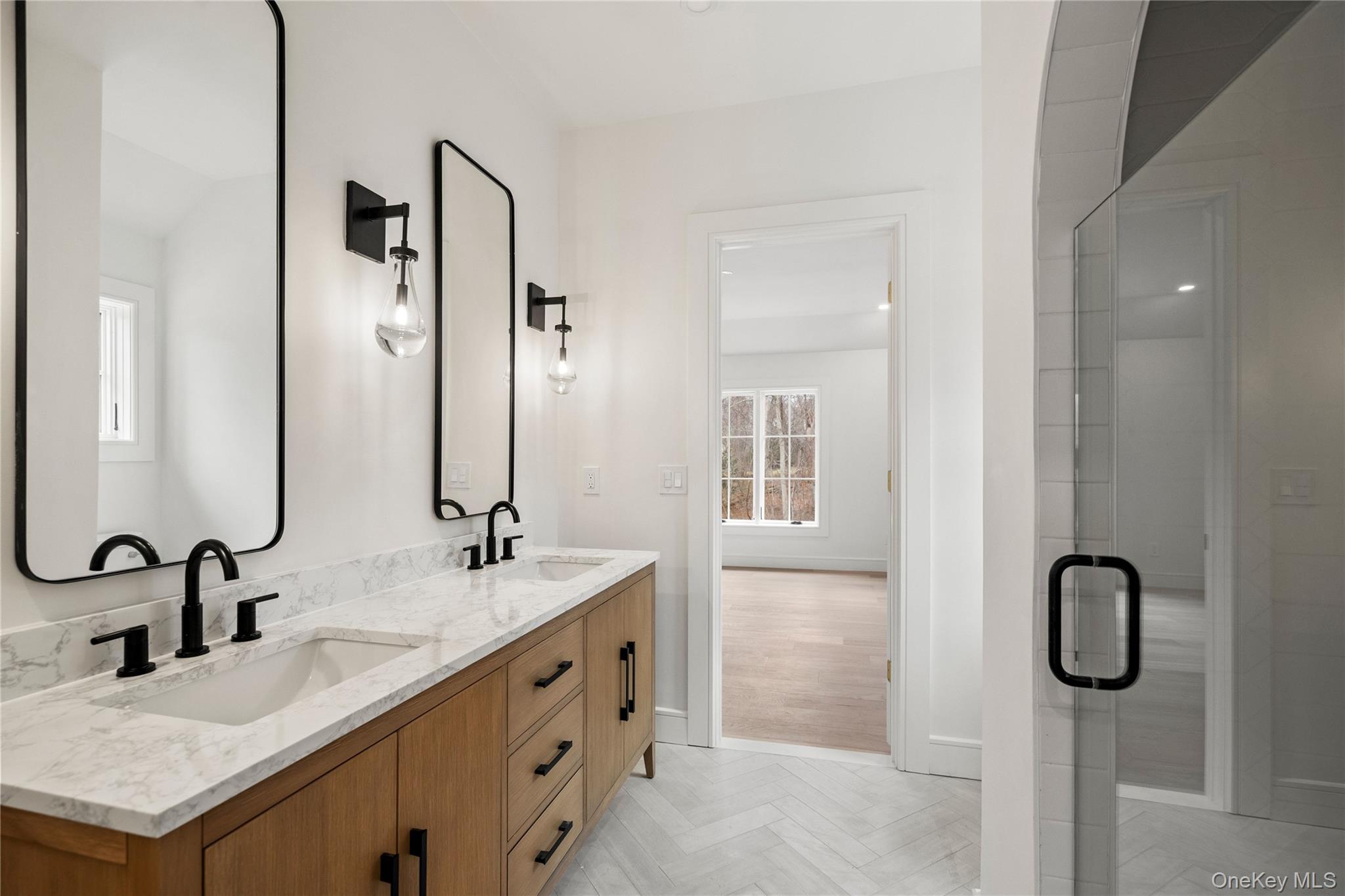 9 Wilderness Road St. James, NY 11780 - Photo 31 of 44 Junior En-Suite with Wide Plank White Oak Flooring, Walk In Closet, Full Bathroom with Walk In Shower, Dual Vanity, Rounded Archway