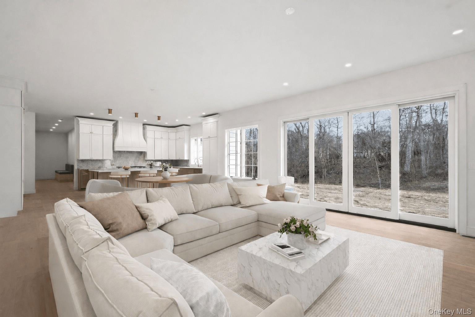 9 Wilderness Road St. James, NY 11780 - Photo 10 of 44 Family Room, Wide Plank White Oak Flooring, Custom Built In Entertainment Center with Rounded Archways, Floor to Ceiling Stone Fireplace