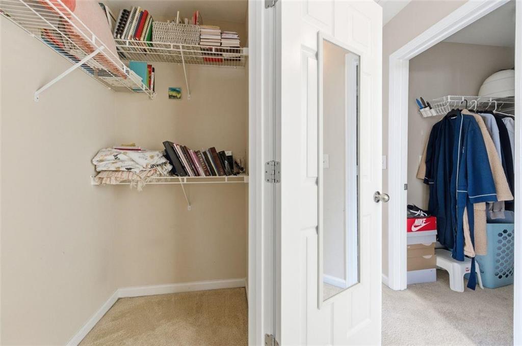 575 Reed Street Southeast Atlanta, GA 30312 - Photo 14 of 21 a view of walk in closet with clothes and shoes