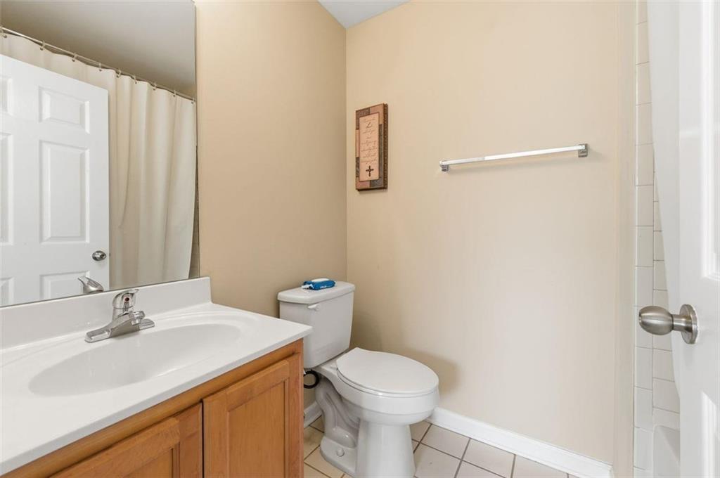 575 Reed Street Southeast Atlanta, GA 30312 - Photo 19 of 21 a bathroom with a sink toilet and vanity