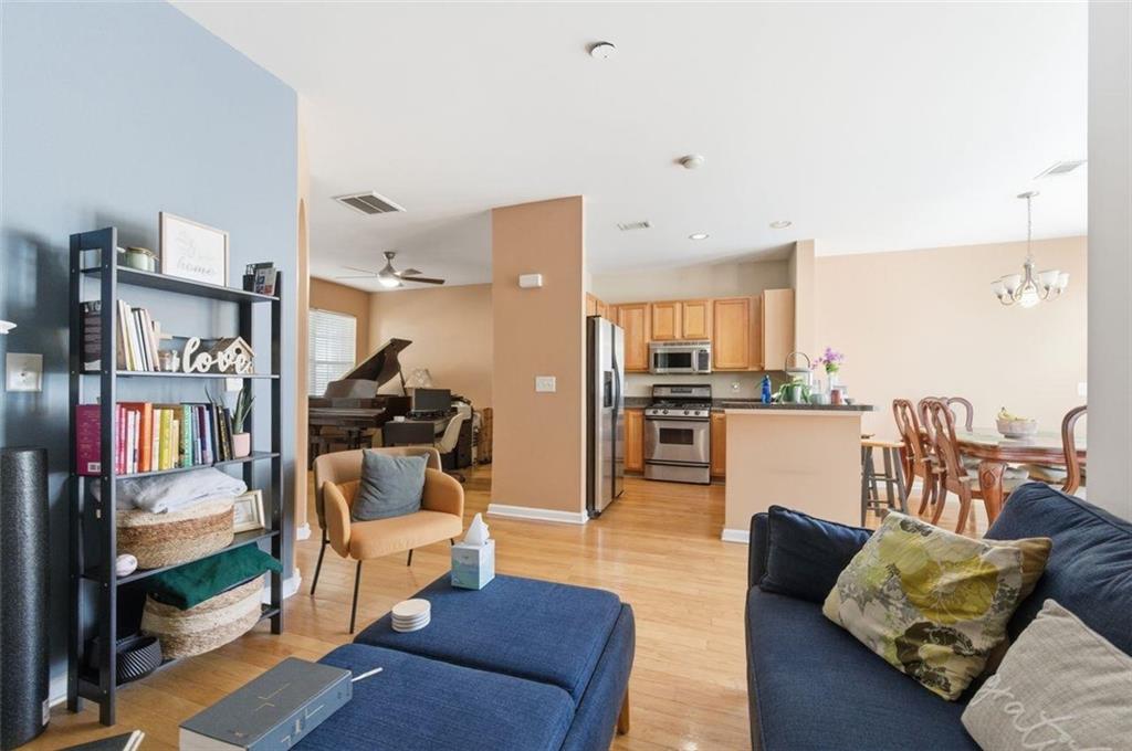 575 Reed Street Southeast Atlanta, GA 30312 - Photo 4 of 21 a living room with furniture and a view of kitchen