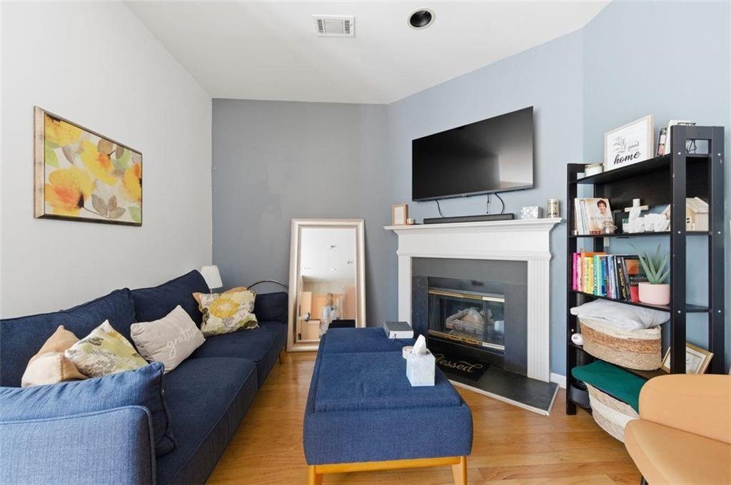 575 Reed Street Southeast Atlanta, GA 30312 - Photo 7 of 21 a living room with furniture fireplace and flat screen tv