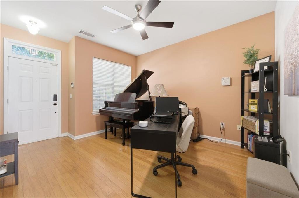 575 Reed Street Southeast Atlanta, GA 30312 - Photo 8 of 21 a view of a workspace with furniture and a living room