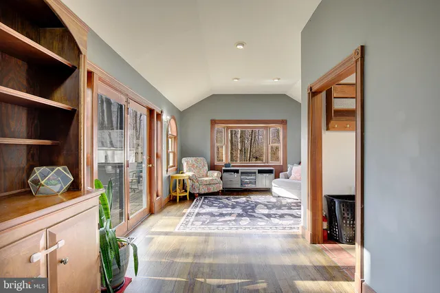 a view of livingroom with furniture wooden floor and windows