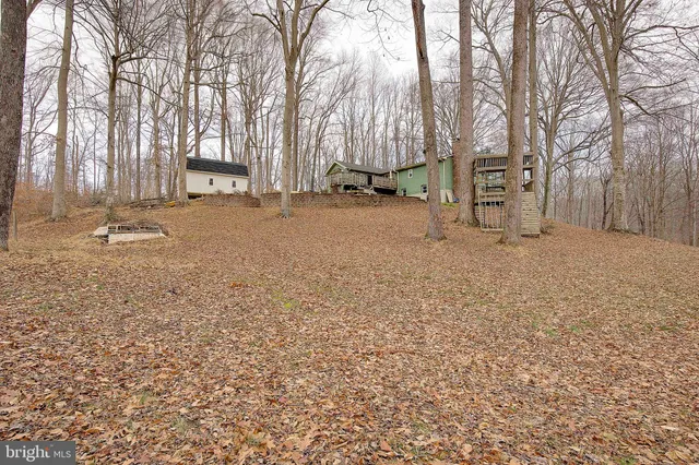 a view of a house with a snow in the yard