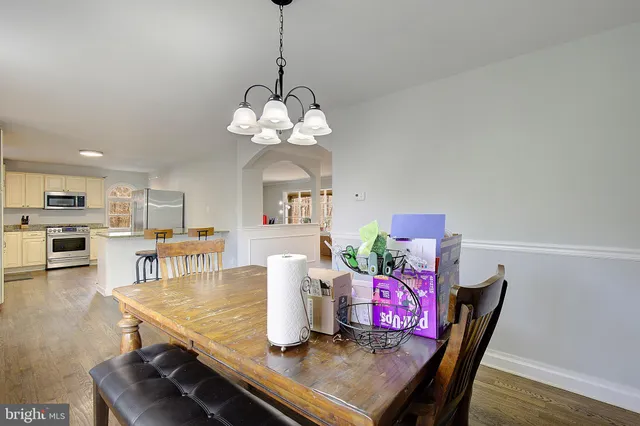 a view of kitchen with furniture and wooden floor