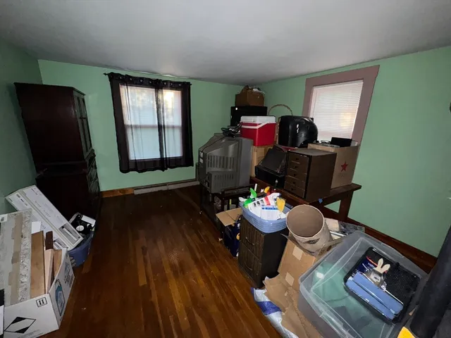 a view of kitchen and wooden floor