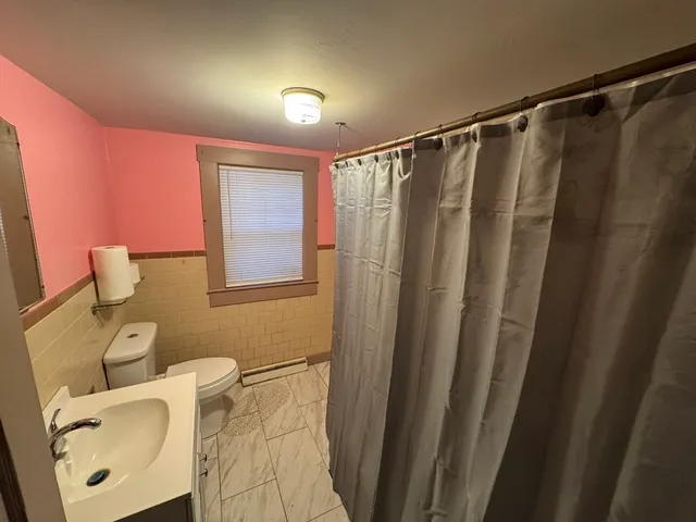a bathroom with a toilet and a sink