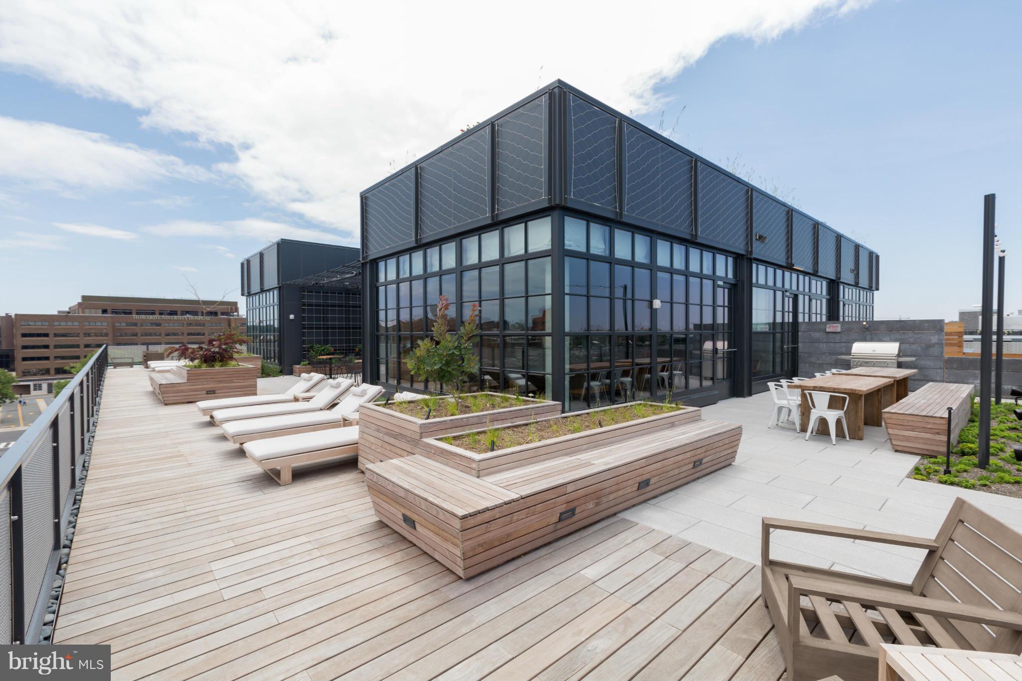 2030 8th Street Northwest, Unit 301 Washington, DC 20001 - Photo 16 of 20 a roof deck with a table and chairs