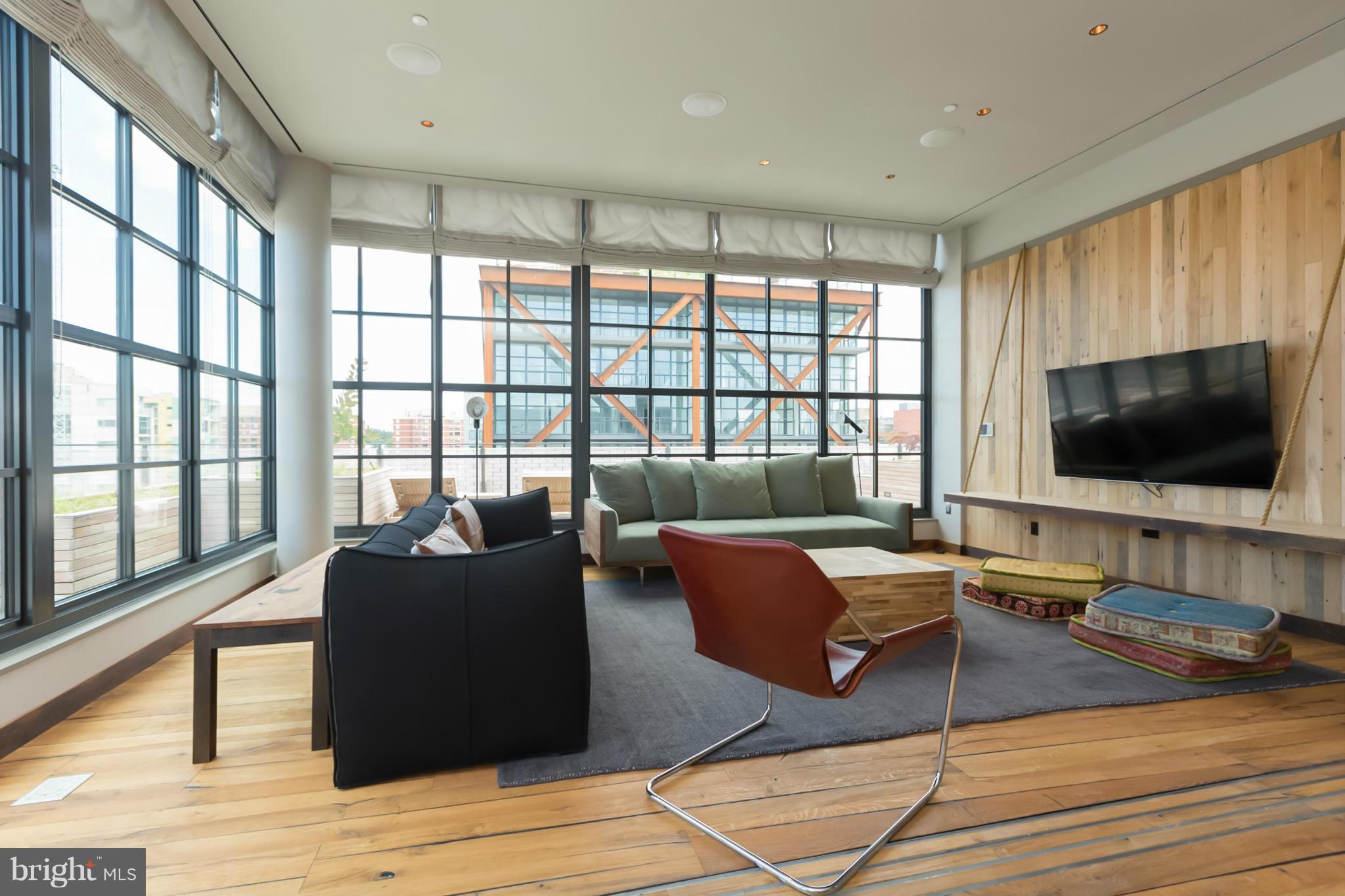2030 8th Street Northwest, Unit 301 Washington, DC 20001 - Photo 18 of 20 a living room with furniture and a flat screen tv