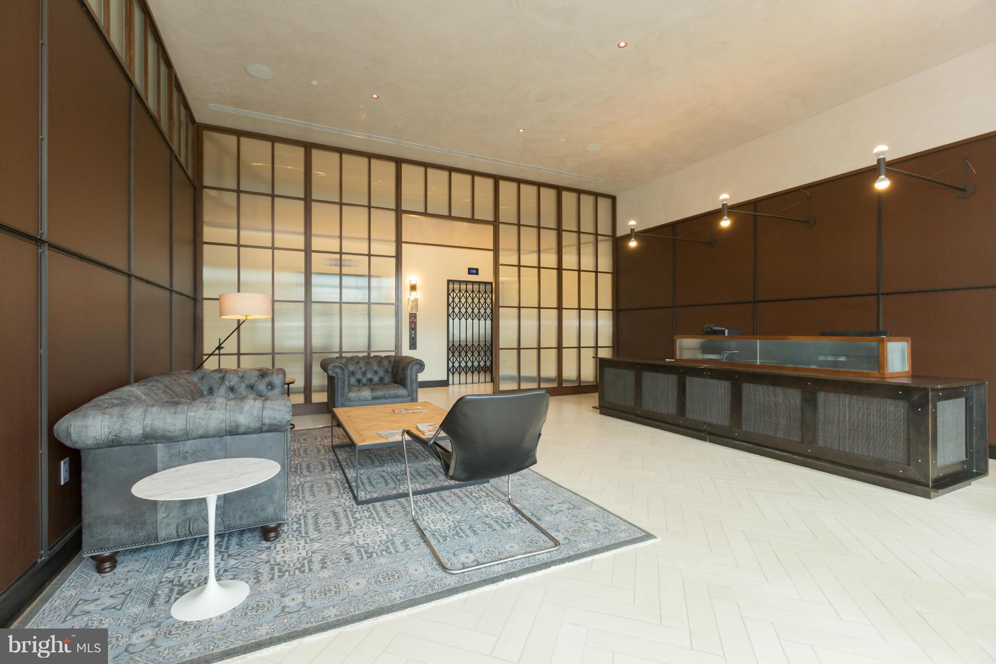 2030 8th Street Northwest, Unit 301 Washington, DC 20001 - Photo 20 of 20 a living room with furniture and a potted plant