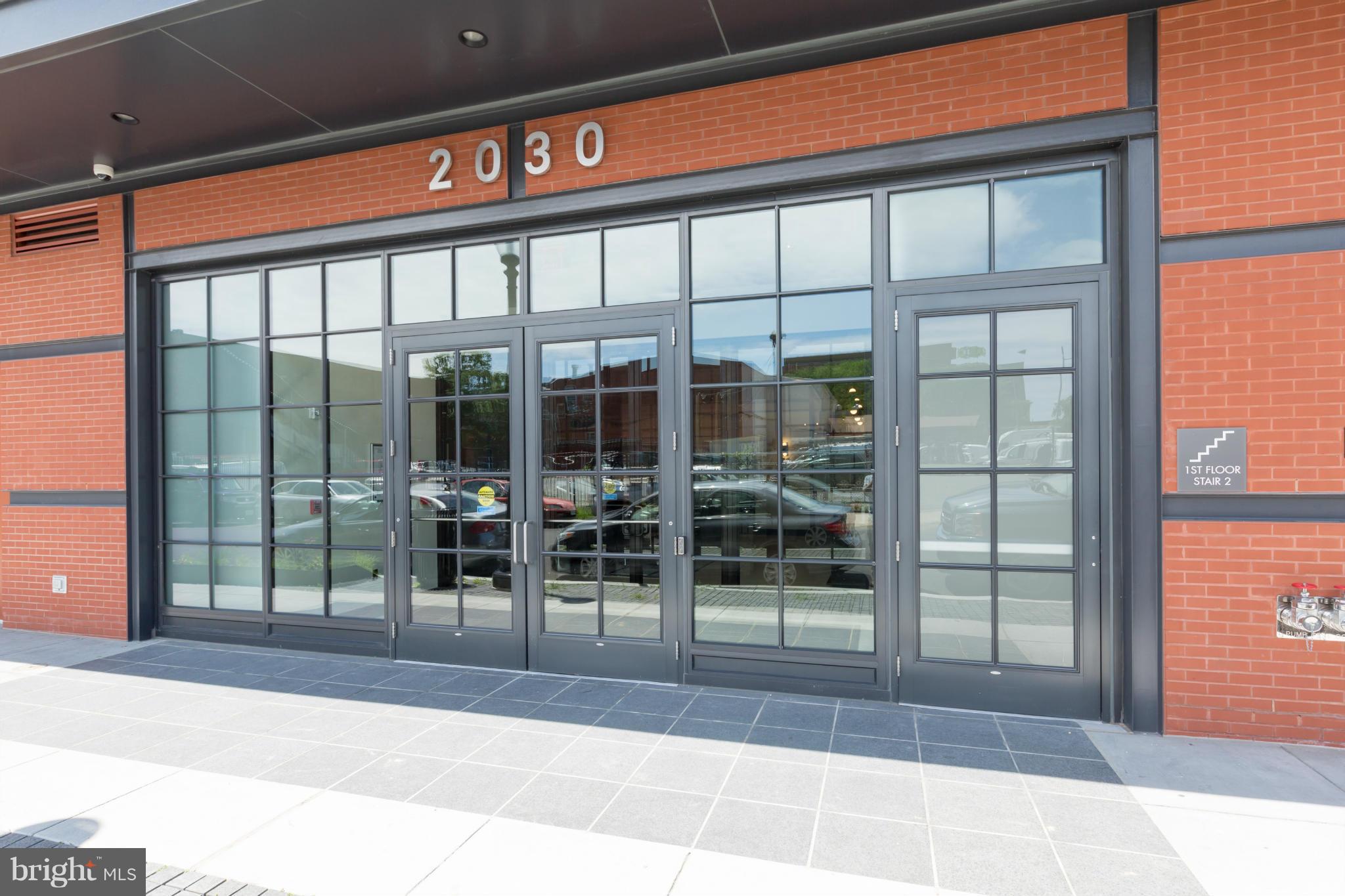 2030 8th Street Northwest, Unit 301 Washington, DC 20001 - Photo 3 of 20 a view of a building with a glass door