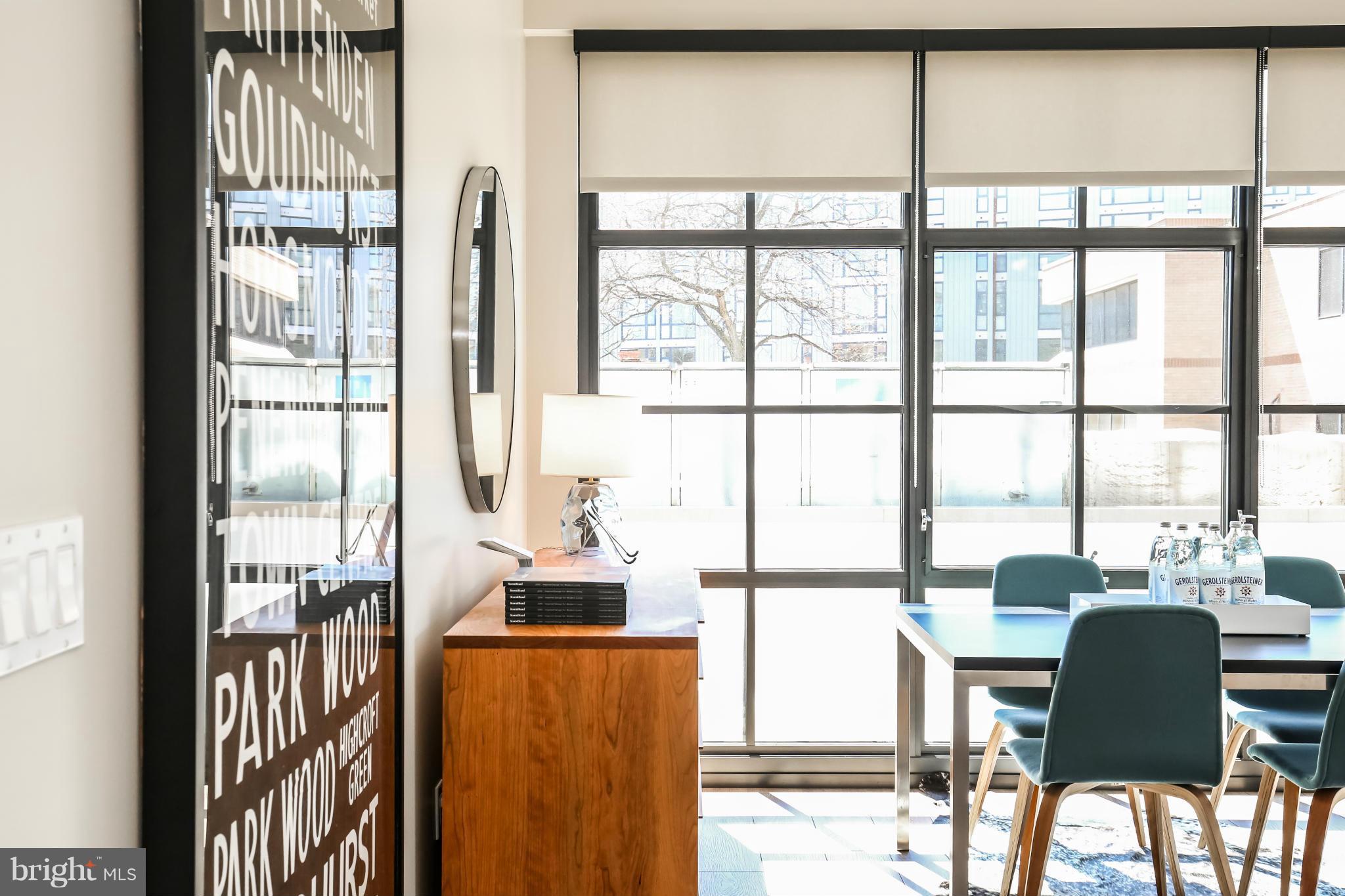 2030 8th Street Northwest, Unit 301 Washington, DC 20001 - Photo 7 of 20 a dining room with furniture water view and large windows