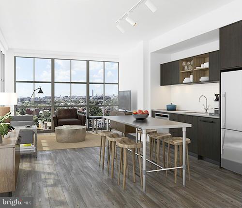 2030 8th Street Northwest, Unit 301 Washington, DC 20001 - Photo 9 of 20 a kitchen with a table chairs stove and kitchen view