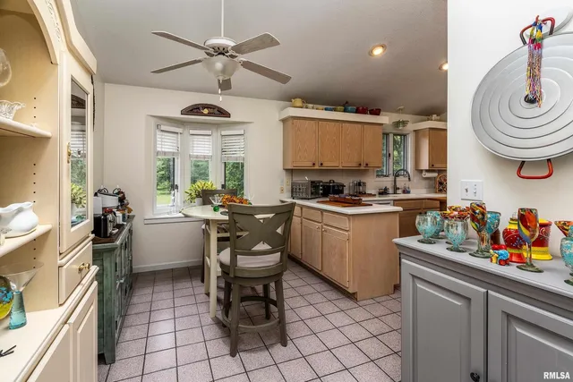 a kitchen that has a sink and a stove