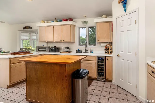 a view of walk in closet with clothes