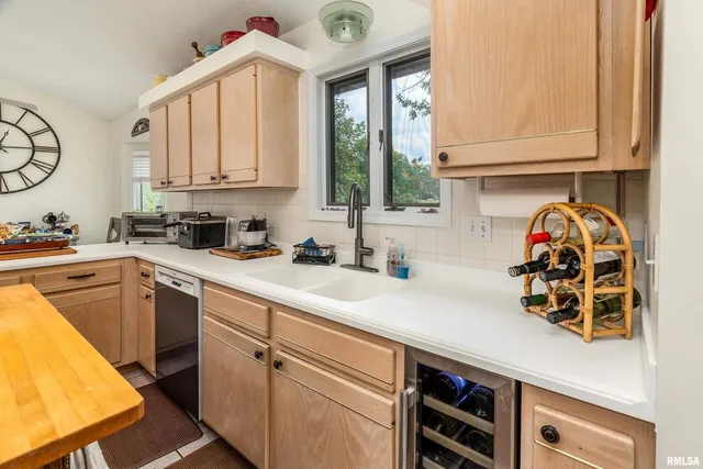 a view of a workspace with furniture and a workspace