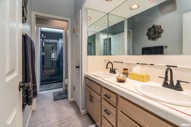 a view of a balcony with wooden floor and outdoor space