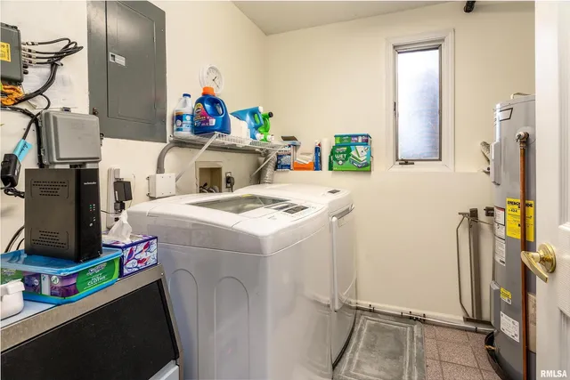 an aerial view of a house with a yard and trees