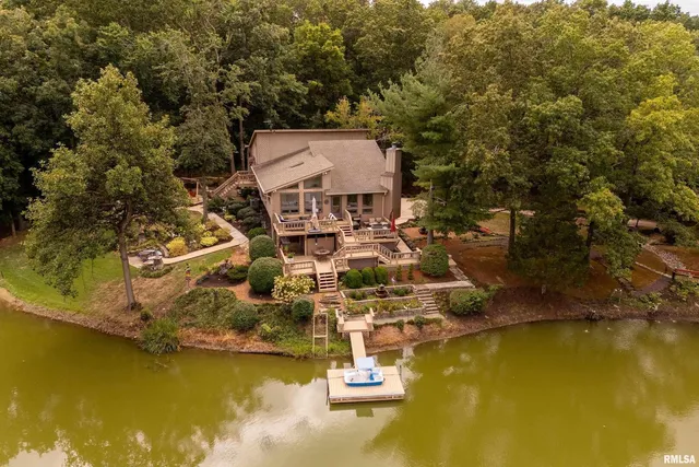 a view of a house with snow on the road